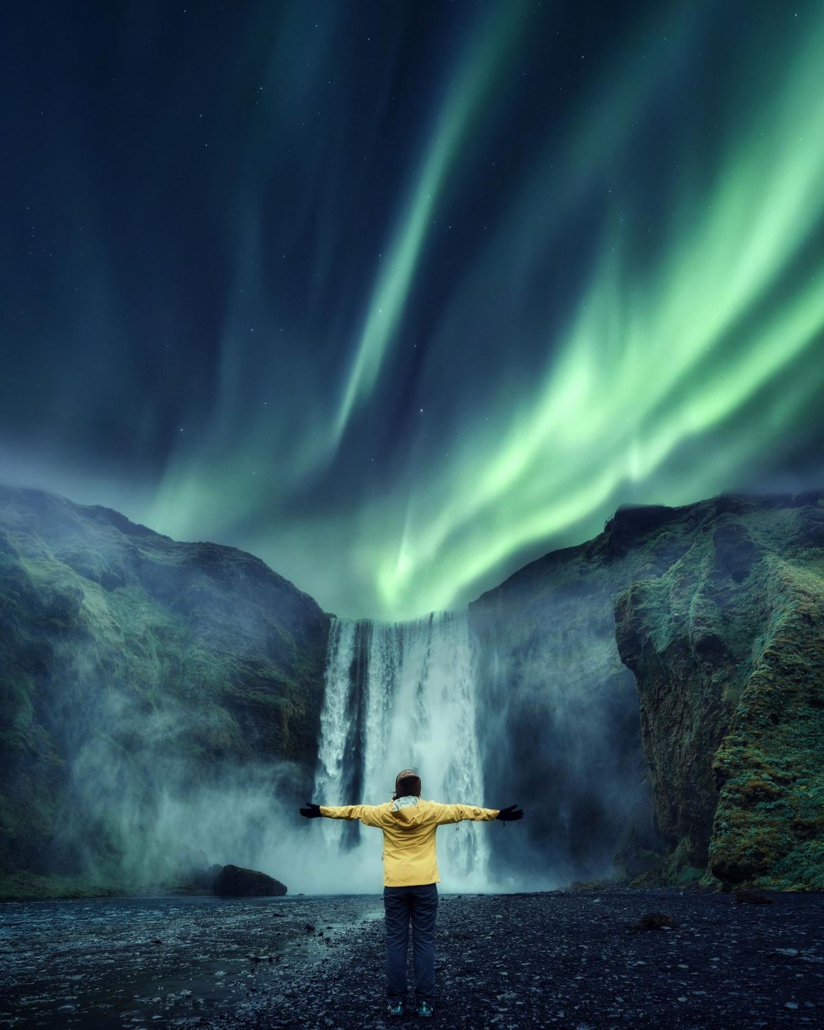 aurora-borealis-skogafoss-waterfall-tourist-woman-standing-travel-famous-place-iceland